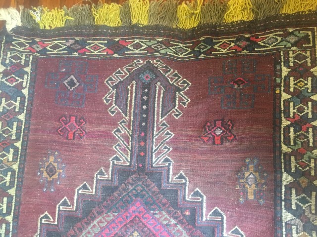 afghani tribal rug handknotted purple background