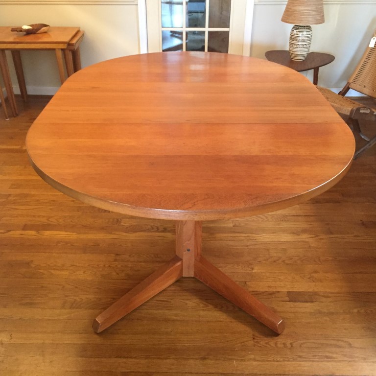 Danish modern solid teak circular dining table with leaves